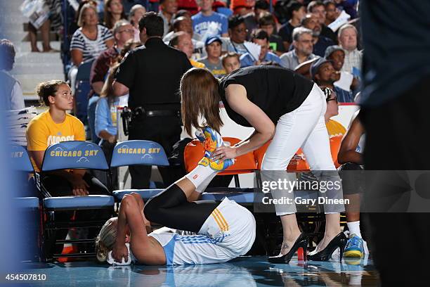 Elena Delle Donne of the Chicago Sky stretches her back on the sideline against the Indiana Fever during game two of the WNBA Eastern Conference...