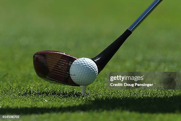 Camilo Villegas of Colombia lines up his shot as he uses a vintage persimmon wood driver to hit a tee shot on the first hole during practice ahead of...