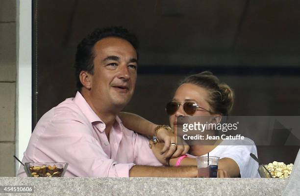 Mary-Kate Olsen and her boyfriend Olivier Sarkozy, brother of former French President Nicolas Sarkozy attend Day 8 of the 2014 US Open at USTA Billie...