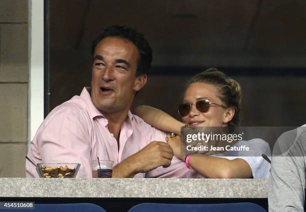 Mary-Kate Olsen and her boyfriend Olivier Sarkozy, brother of former French President Nicolas Sarkozy attend Day 8 of the 2014 US Open at USTA Billie...