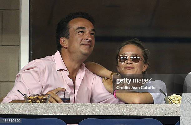 Mary-Kate Olsen and her boyfriend Olivier Sarkozy, brother of former French President Nicolas Sarkozy attend Day 8 of the 2014 US Open at USTA Billie...