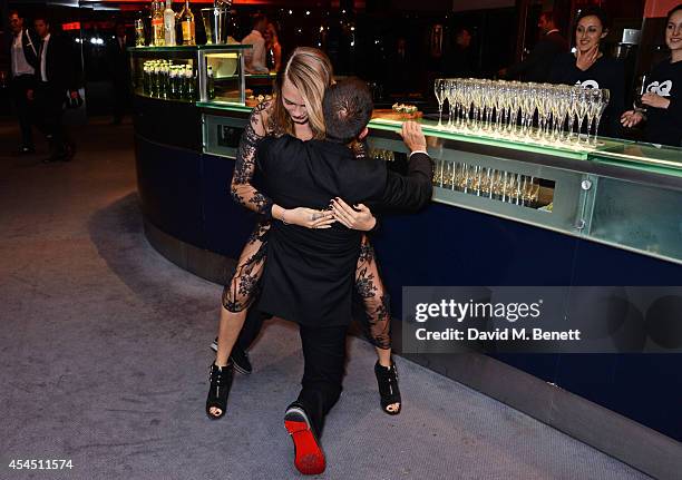 Cara Delevingne and Jonathan Saunders attend the GQ Men Of The Year awards in association with Hugo Boss at The Royal Opera House on September 2,...