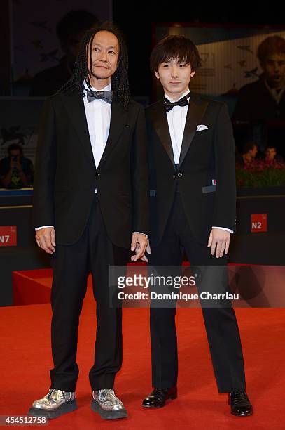 Tatsuya Nakamura and Yusaku Mori attends the 'Fires On The Plain' premiere during the 71st Venice Film Festival at Sala Grande on September 2, 2014...