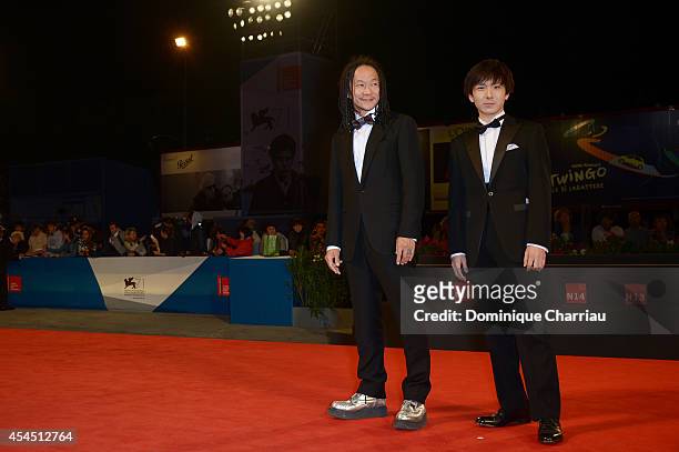 Tatsuya Nakamura and Yusaku Mori attends the 'Fires On The Plain' premiere during the 71st Venice Film Festival at Sala Grande on September 2, 2014...
