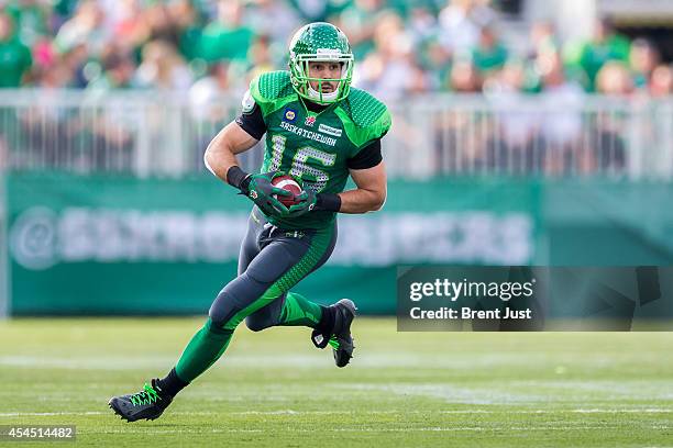 Brett Swain of the Saskatchewan Roughriders runs after a catch in a game between the Montreal Alouettes and Saskatchewan Roughriders in week 8 of the...