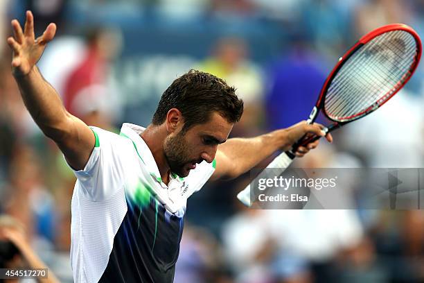 Marin Cilic of Croatia celebrates after defeating Gilles Simon of France in their men's singles fourth round match on Day Nine of the 2014 US Open at...