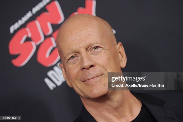 Actor Bruce Willis arrives at the Los Angeles premiere of 'Sin City: A Dame To Kill For' at TCL Chinese Theatre on August 19, 2014 in Hollywood,...