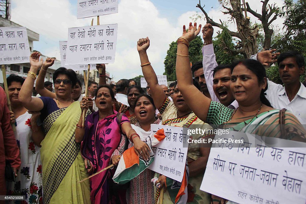 Congress party workers shout slogans during their "Wada...