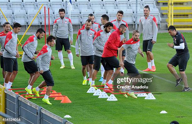 Turkey national football team players exercise during the team's training session ahead of friendly game against Denmark at TREFOR Park in Odense,...
