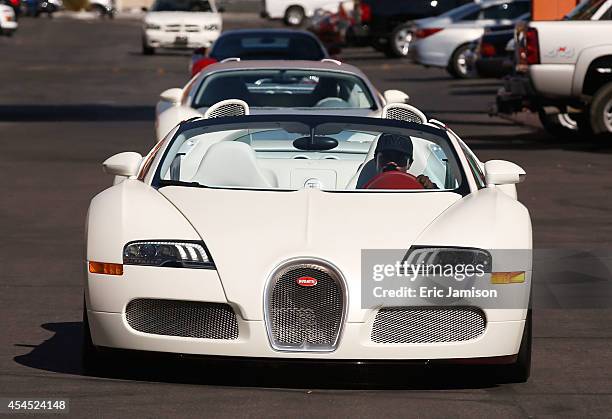 Boxer Floyd Mayweather Jr. Arrives in his Bugatti for a workout at the Mayweather Boxing Club on September 2, 2014 in Las Vegas, Nevada. Mayweather...