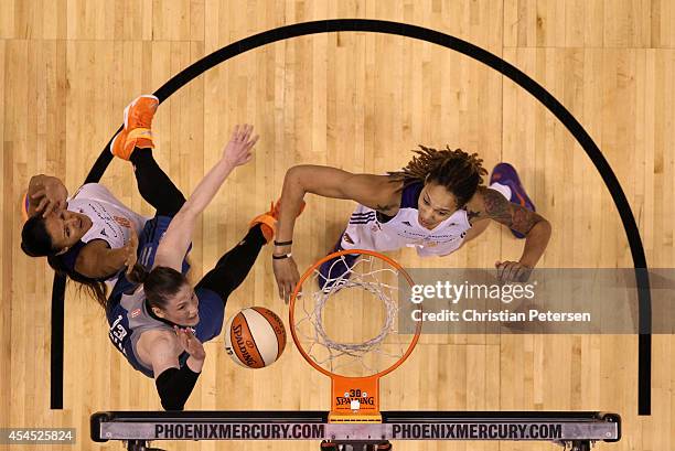 Lindsay Whalen of the Minnesota Lynx lays up a shot over Brittney Griner of the Phoenix Mercury during the first half of game three of the WNBA...