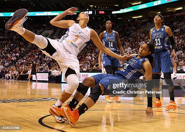 Diana Taurasi of the Phoenix Mercury collides with Maya Moore of the Minnesota Lynx during the second half of game three of the WNBA Western...