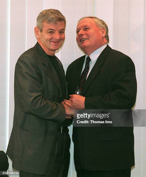 Joschka Fischer, member of the Green Party and Oskar Lafontaine, member of the SPD coming together for coalition negotiations on October 02 in Bonn,...