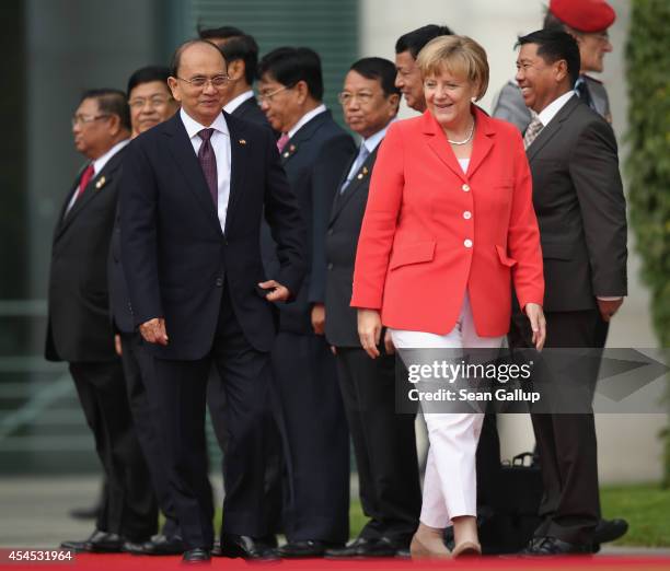 German Chancellor Angela Merkel and Myanmar President Thein Sein chat upon Thein Sein's arrival at the Chancellery on September 3, 2014 in Berlin,...