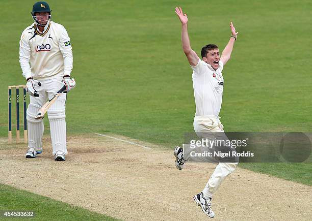 Peter Chase celebrates taking the wicket of Luke Fletcher of Nottinghamshire during the LV County Championship match between Durham and...