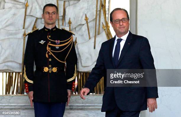 French President Francois Hollande leaves after a weekly cabinet meeting at the Elysee Presidential Palace in Paris on September 3 in Paris, France.