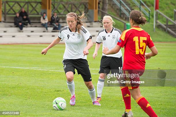 Stefanie-Antonia Sanders and Jule Dallmann of Germany challenges Diana Cristina Grecu of Romania during the international friendly match between U17...