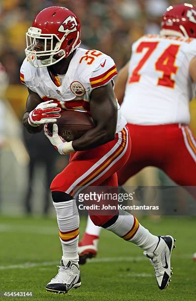 Cyrus Gray of the Kansas City Chiefs runs the ball during a preseason game against the Green Bay Packers on August 28, 2014 at Lambeau Field in Green...