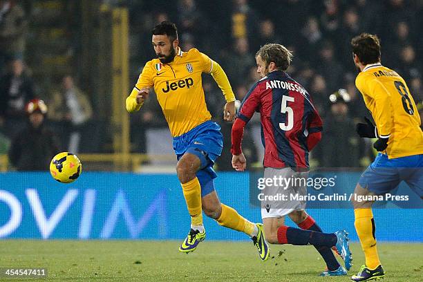 Mirko Vucinic of Juventus competes for the ball with Mikael Antonsson of Bologna FC during the Serie A match between Bologna FC and Juventus at...