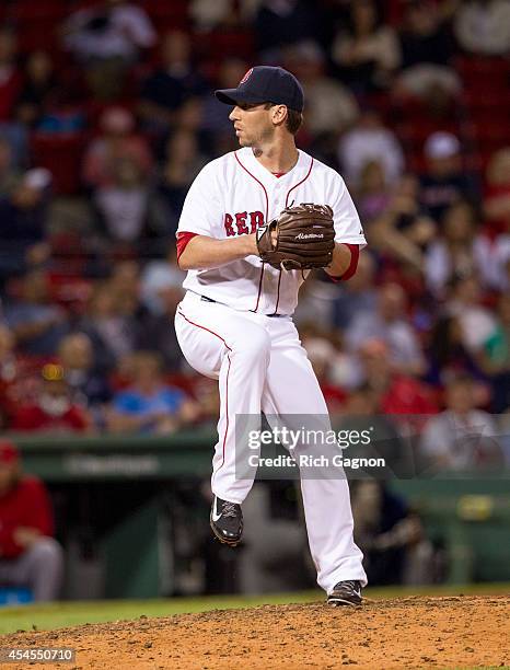 Craig Breslow of the Boston Red Sox pitches during the ninth inning against the Los Angeles Angels of Anaheim at Fenway Park on August 20, 2014 in...