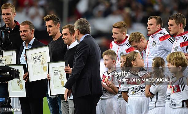 Germany's defender Per Mertesacker , Germany's assistant coach Hansi Flick , Germany's forward Miroslav Klose , Germany's midfielder Philipp Lahm ,...