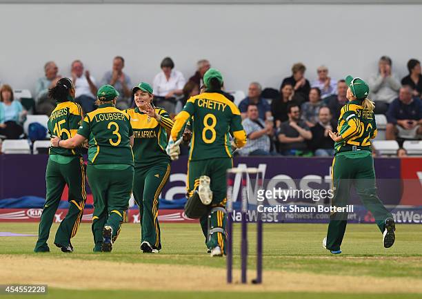 Moseline Daniels of South Africa celebrates with team-mates after taking a wicket during the NatWest Women's International T20 match between England...