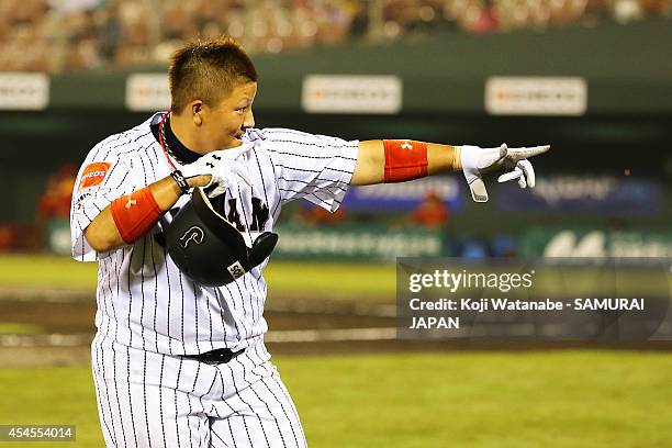 Catcher Tomomi Nishi celerates after scoring during in the bottom half of the third inning the IBAF Women's Baseball World Cup Group A game between...