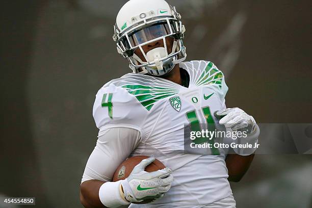 Defensive back Erick Dargan of the Oregon Ducks warms up prior to the game against the South Dakota Coyotes at Autzen Stadium on August 30, 2014 in...