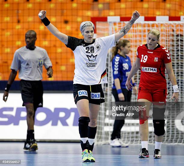 Germanys Anja Althaus celebrate past Czech Republic's Helena Sterbova during the Women's Handball World Championship 2013 match Czech Republic vs...