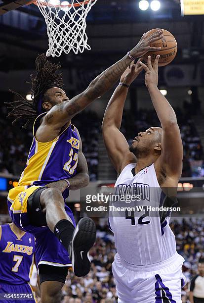 Chuck Hayes of the Sacramento Kings has his shot blocked by Jordan Hill of the Los Angeles Lakers at Sleep Train Arena on December 6, 2013 in...
