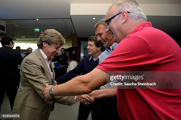 Frank Mill is welcomed by Otto Rehhagel, Rudolf "Rudi" Bommer and Manfred Bockenfeld during the 'Club Of Former National Players' meeting prior to...