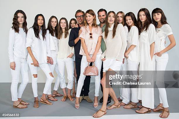 Designers Jens Grede and Erik Torstensson pose with model / blogger Hanneli Mustaparta at the Frame Denim presentation on September 3, 2014 in New...