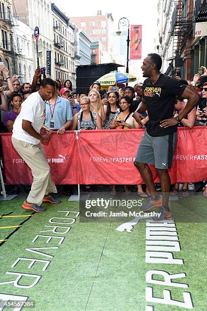 Usain Bolt and Shaka Hislop attend The PUMA Store Soho Training Event on September 3, 2014 in New York City.