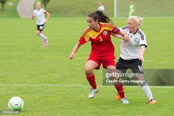 Jule Dallmann of Germany challenges Teodora Meluta of Romania during the international friendly match between U17 Girl's Germany and U17 Girl's...