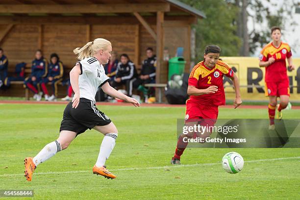 Jule Dallmann of Germany challenges Alina Boros of Romania during the international friendly match between U17 Girl's Germany and U17 Girl's Romania...