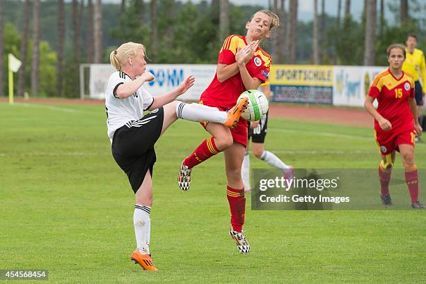 Jule Dallmann of Germany challenges Dariana Persida of Romania during the international friendly match between U17 Girl's Germany and U17 Girl's...