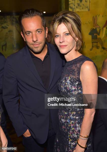 Vice President of PR at Prada Christian Langbein and Editor-in-Chief of Elle Magazine Robbie Myers attend the New York Times Vanessa Friedman and...