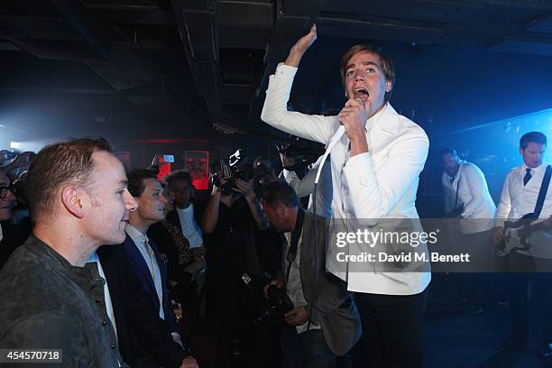 Pelle Almqvist of The Hives performs as John Varvatos launch their first European store in London, on September 3, 2014 in London, England.