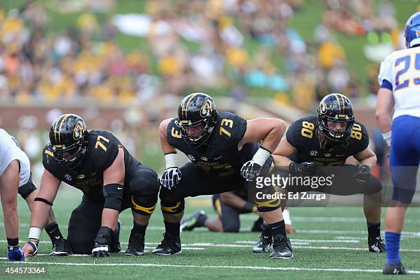 Evan Boehm, Mitch Hall and Sean Culkin of the Missouri Tigers in action against the South Dakota State Jackrabbits at Memorial Stadium on August 30,...