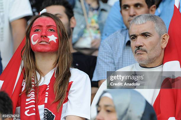 Turkish fans show their support during an international friendly match between Denmark and Turkey at TREFOR Park in Odense, Denmark on September 3,...