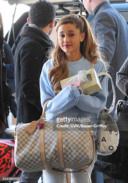 Ariana Grande is seen arriving at LAX airport on December 09, 2013 in Los Angeles, California.
