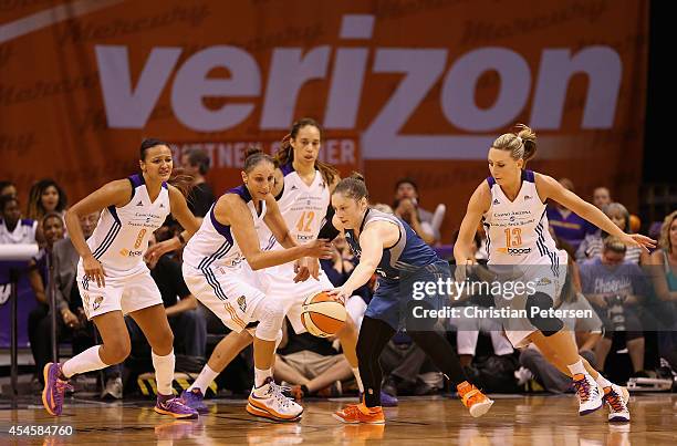 Diana Taurasi and Penny Taylor of the Phoenix Mercury battle for a loose ball with Lindsay Whalen of the Minnesota Lynx during game three of the WNBA...