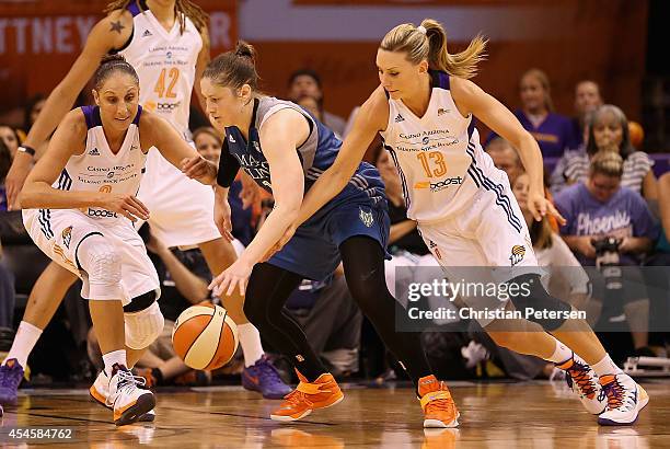 Diana Taurasi and Penny Taylor of the Phoenix Mercury battle for a loose ball with Lindsay Whalen of the Minnesota Lynx during game three of the WNBA...