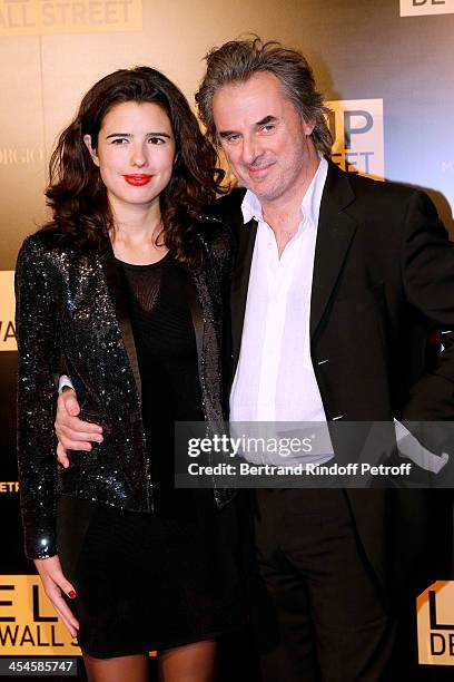 Writer Jean-Christophe Grange and companion Carmen Fernandez Santa Cruz attend the photocall before the party for 'The Wolf of Wall Street' World...