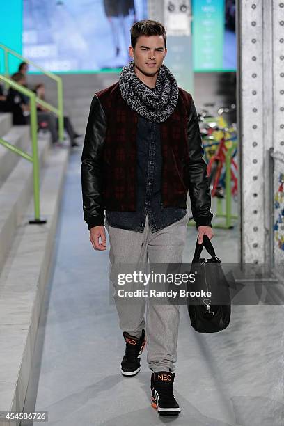 Model walks the runway at Adidas Neo during Mercedes-Benz Fashion Week Spring 2015 at The Waterfront on September 3, 2014 in New York City.