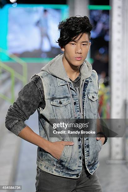 Model walks the runway at Adidas Neo during Mercedes-Benz Fashion Week Spring 2015 at The Waterfront on September 3, 2014 in New York City.