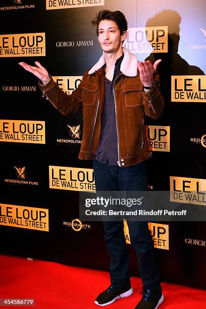 Actor Pierre Niney attends the photocall before the 'The Wolf of Wall Street' World movie Premiere at Cinema Gaumont Opera on December 9, 2013 in...