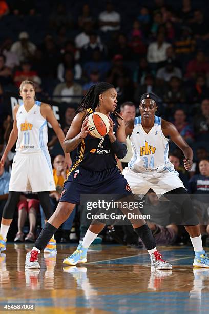 Erlana Larkins of the Indiana Fever handles the ball during game two of the WNBA Eastern Conference Finals against Sylvia Fowles of the Chicago Sky...