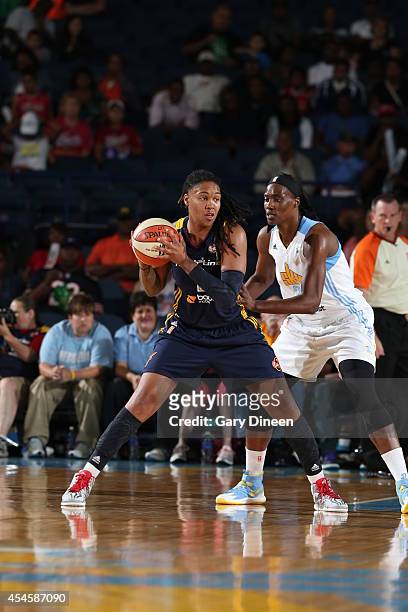 Erlana Larkins of the Indiana Fever handles the ball during game two of the WNBA Eastern Conference Finals against Sylvia Fowles of the Chicago Sky...