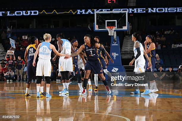 Courtney Vandersloot of the Chicago Sky and Erlana Larkins of the Indiana Fever shake hands before game two of the WNBA Eastern Conference Finals as...